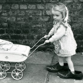 Girl with pram Shirley Baker