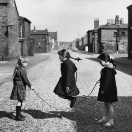 Shirley Baker photograph of three children skipping in the road