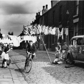 shirley baker boy on bike cycling photograph